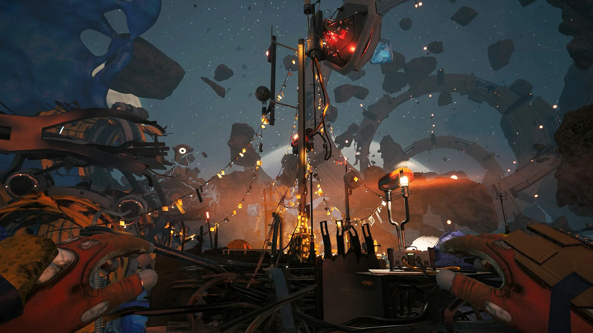 First-person view of a debris field with string lights, a red beacon, a one-eyed robot and broken station rings against stars.