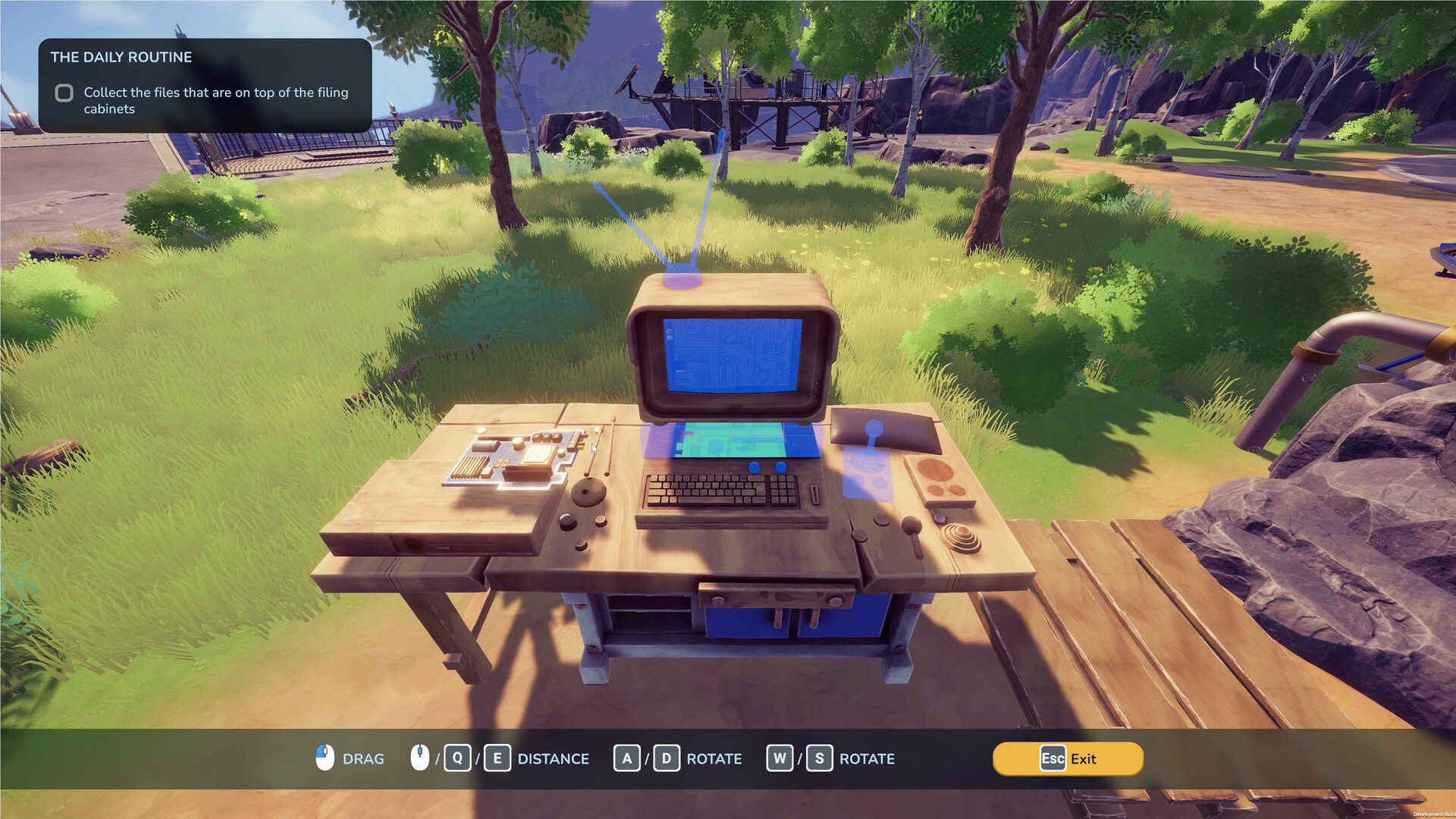 A wooden computer being positioned on an outdoor workbench.