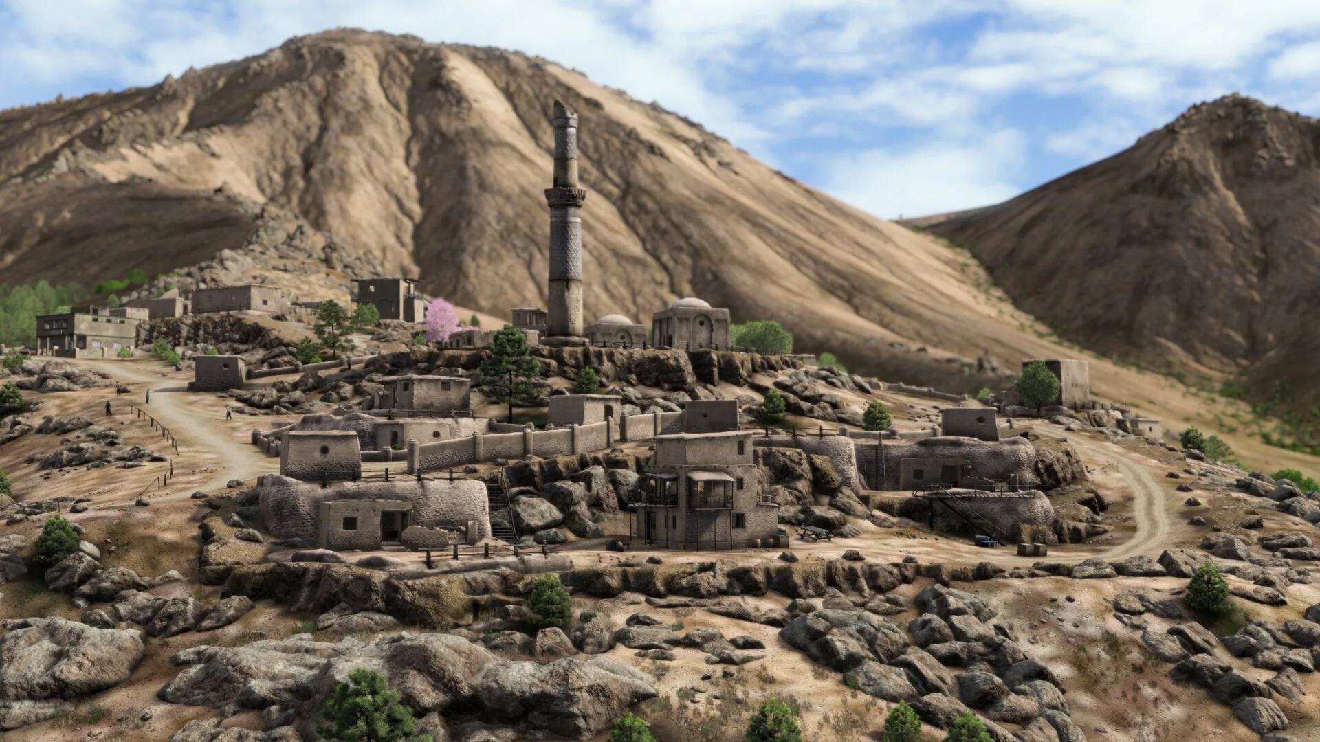 Stone houses and a minaret on a hillside