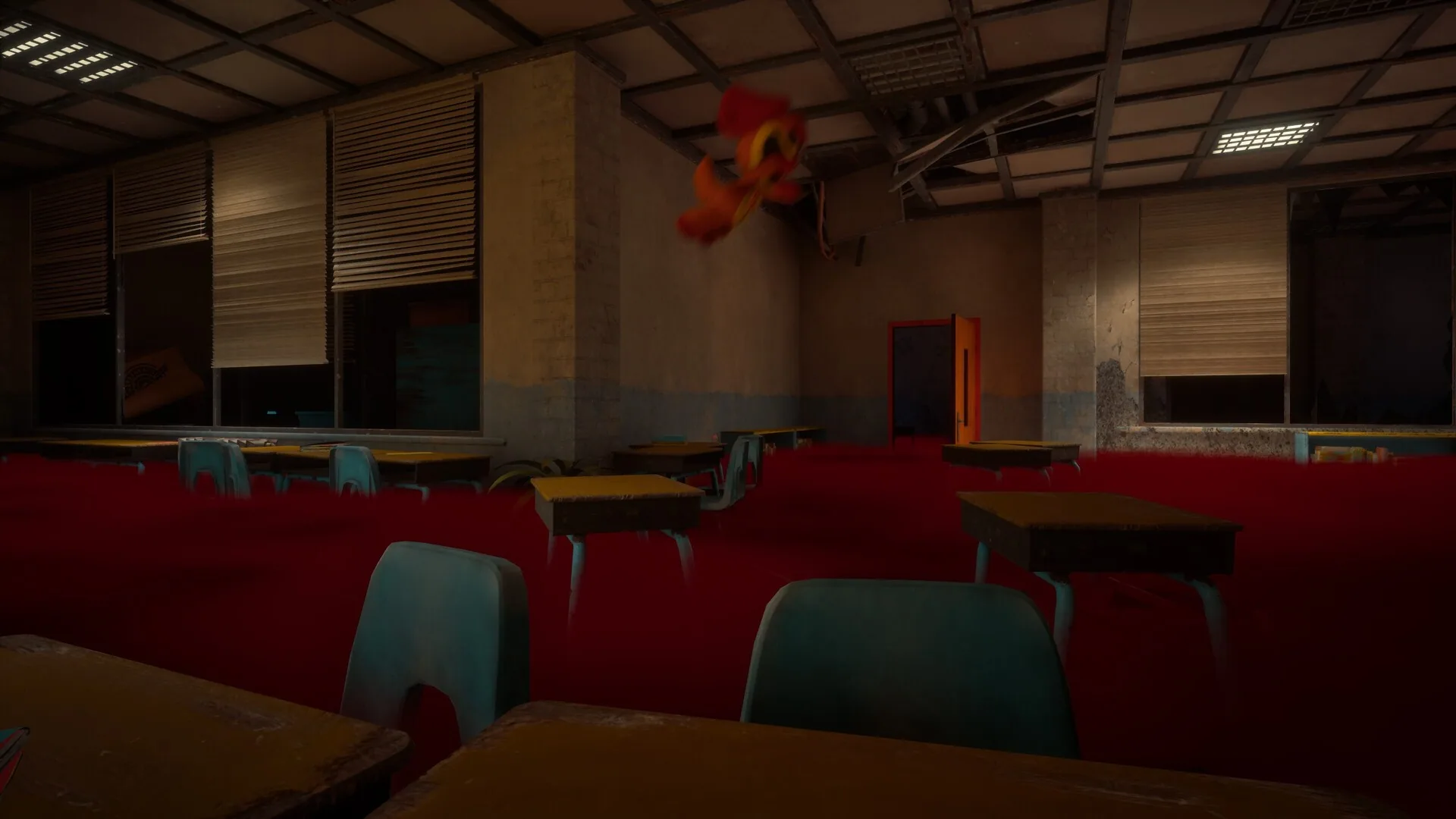Red light over rows of classroom desks
