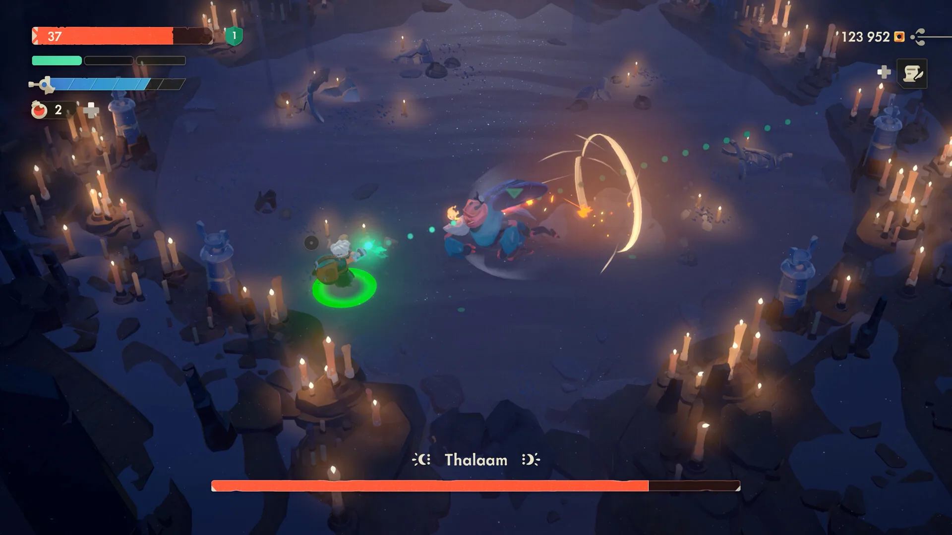Boss fight against Thalaam in a candle-lit cavern.