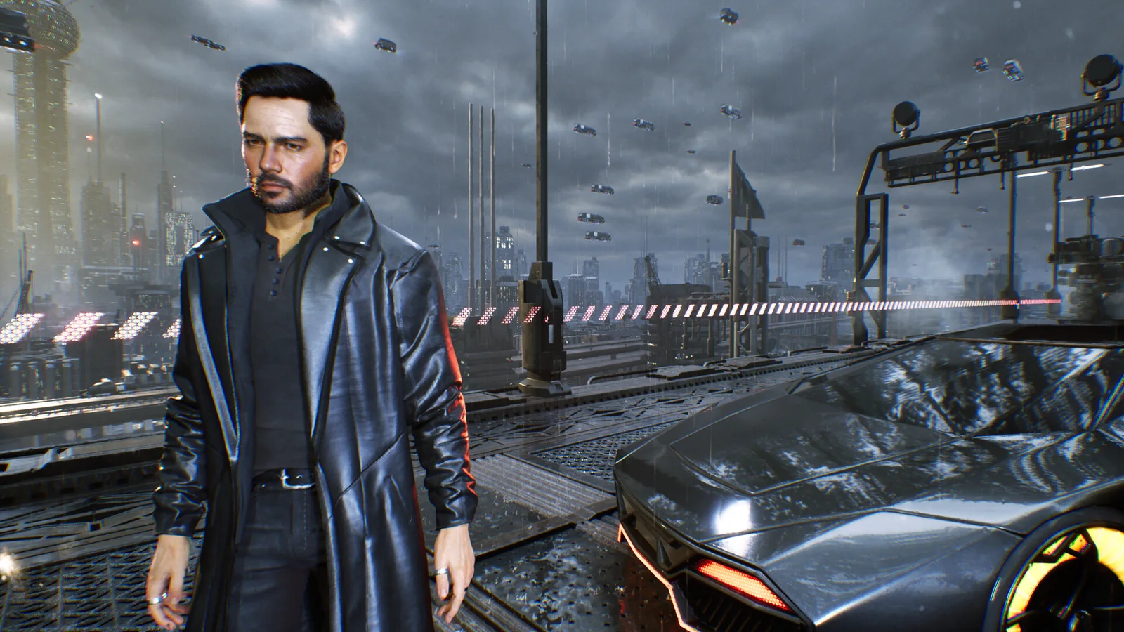 Nolan in a black coat on a wet rooftop beside a sports car.