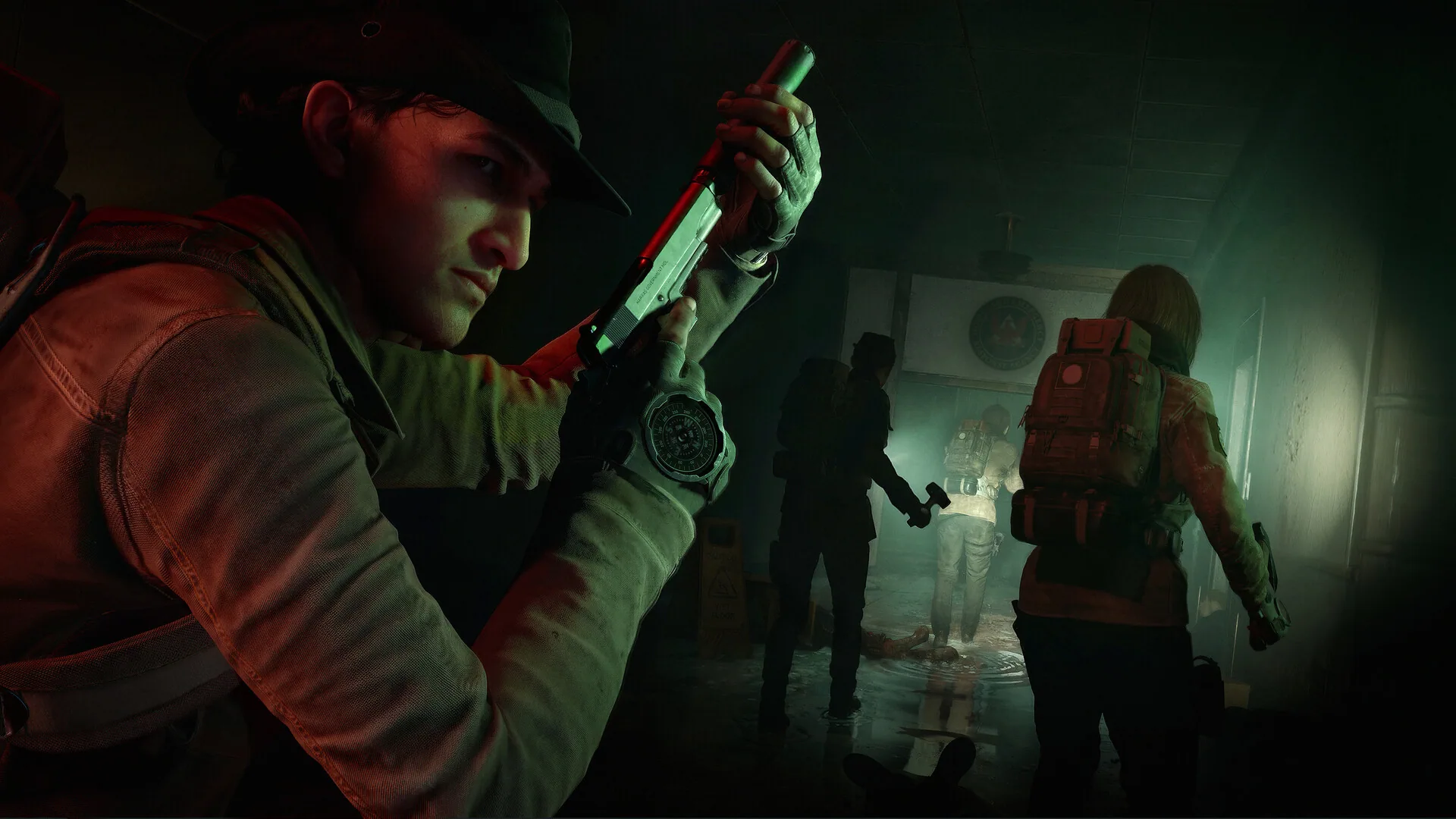 Official Steam screenshot of a hat-wearing Responder checking a pistol while a squad advances down a flooded institutional hallway.