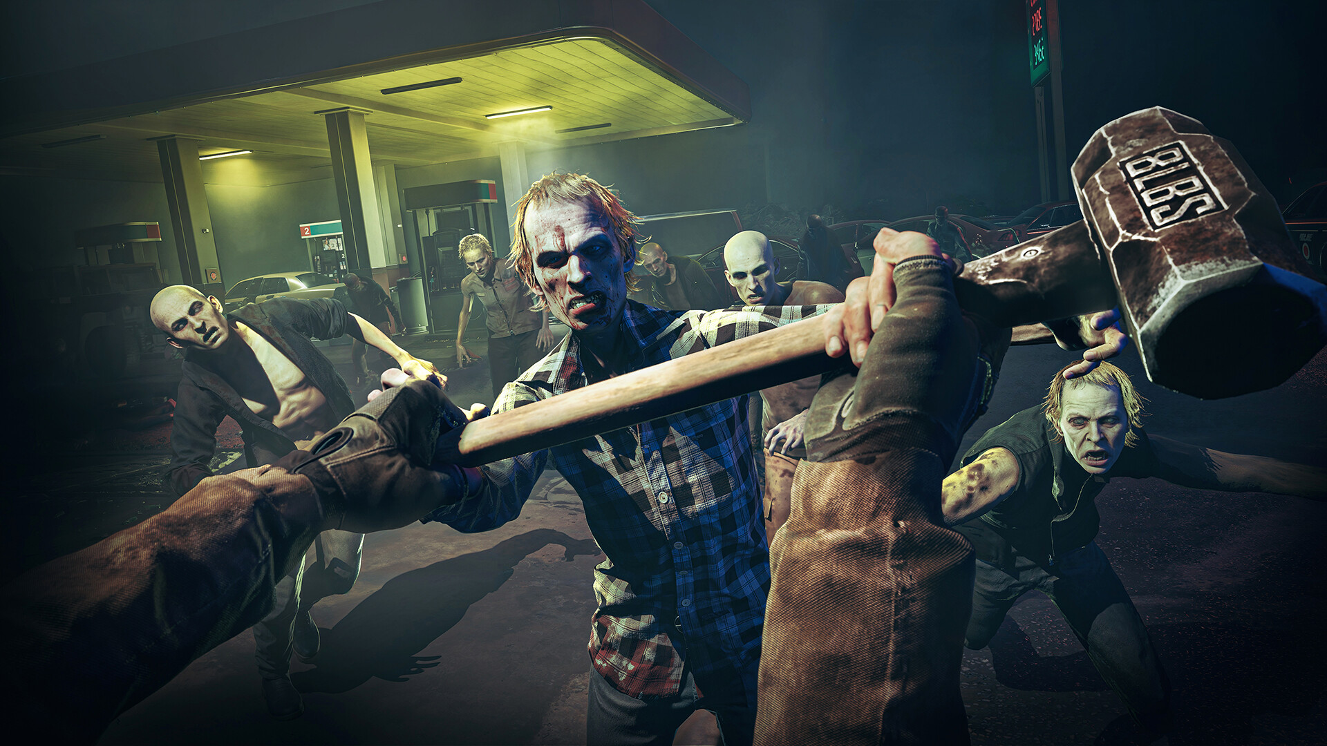 Official Steam screenshot of a first-person melee struggle over a sledgehammer with several zombies at a night gas station.