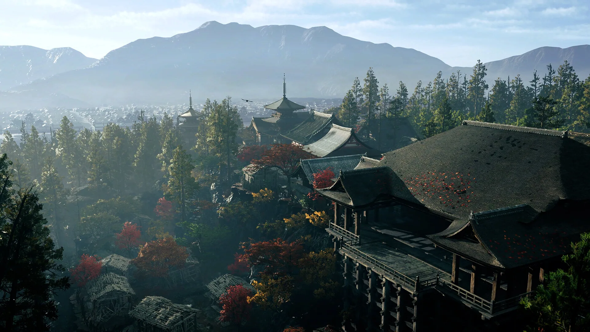 Elevated view of a mountainside temple complex with autumn maples above a Kyoto basin