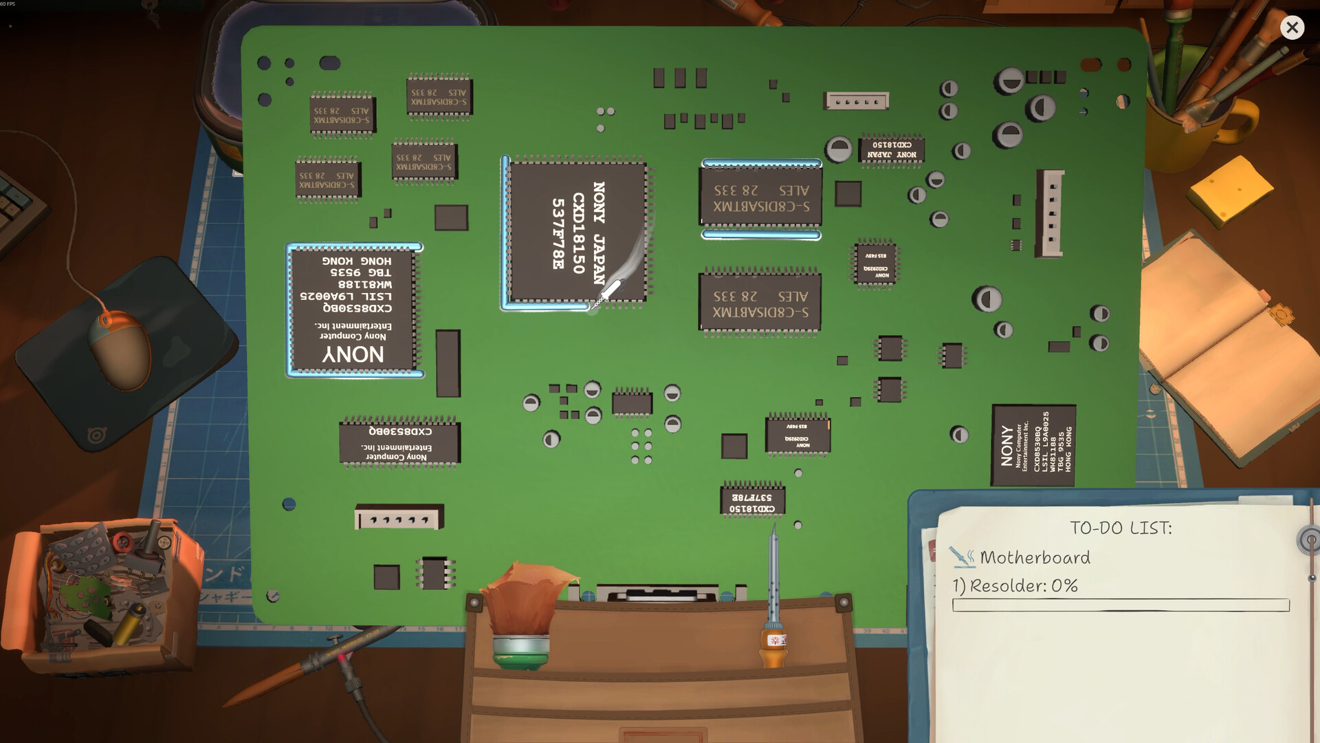 Green circuit board on a repair mat with a soldering tool and resolder task interface.