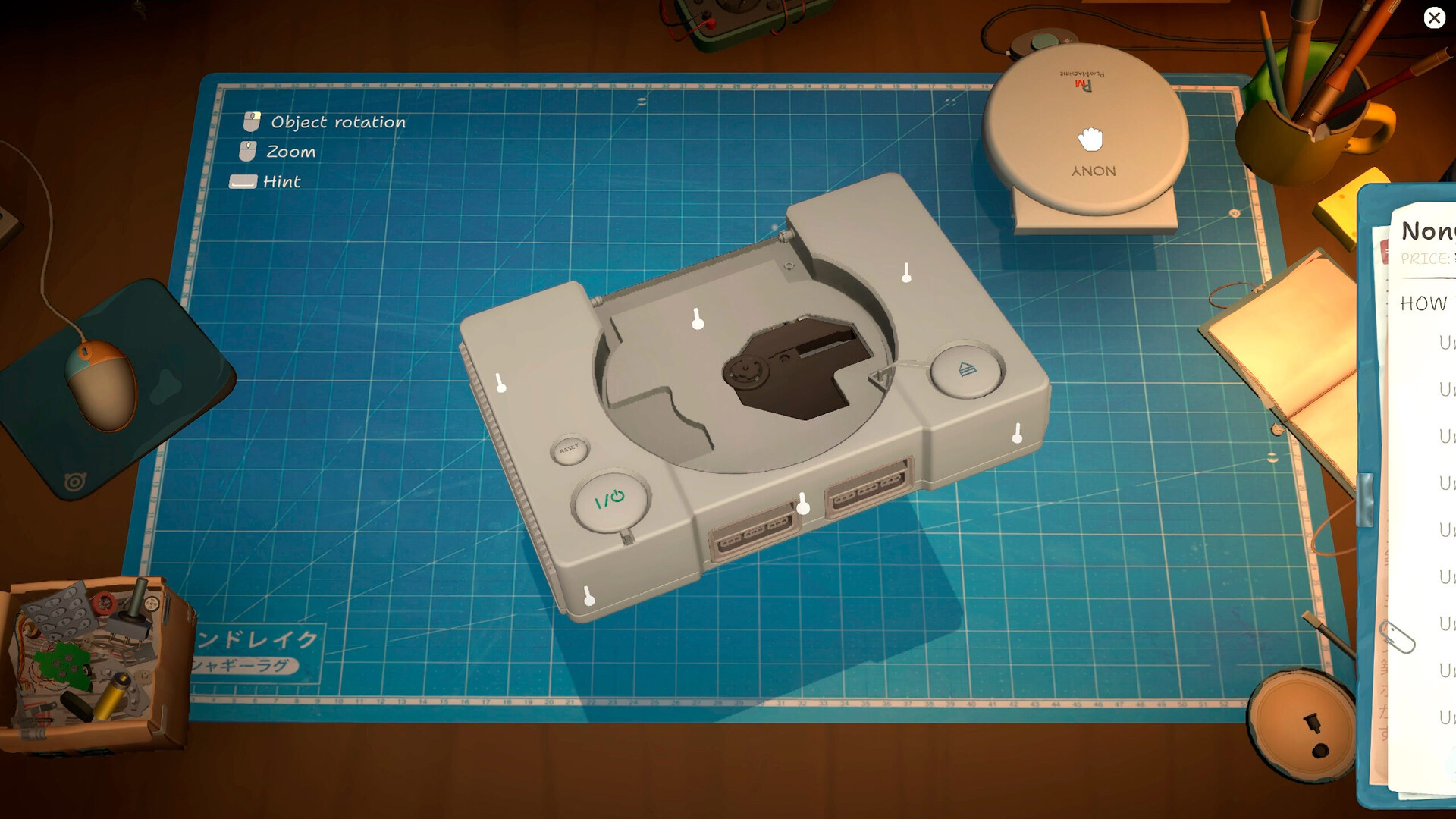 White retro console on a repair mat with visible screws and a component tray.