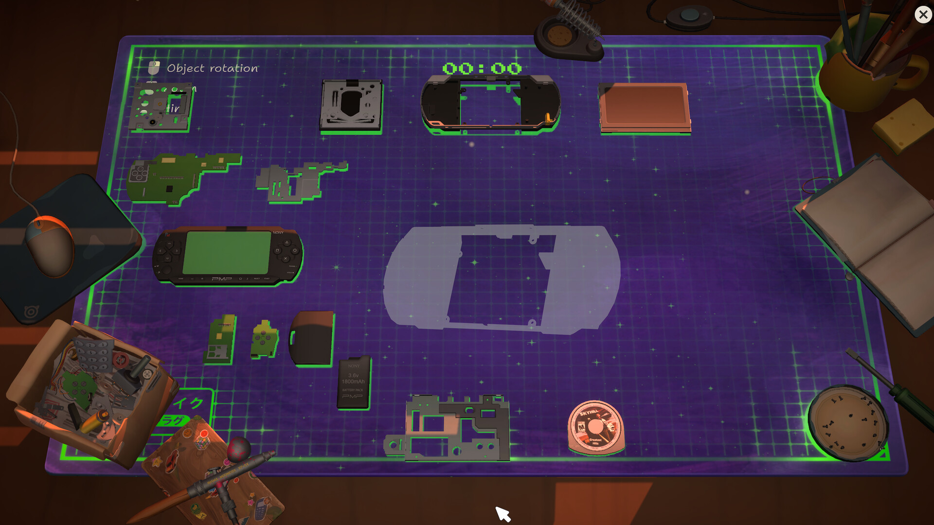 Multiple disassembled handheld parts arranged on a glowing repair mat.