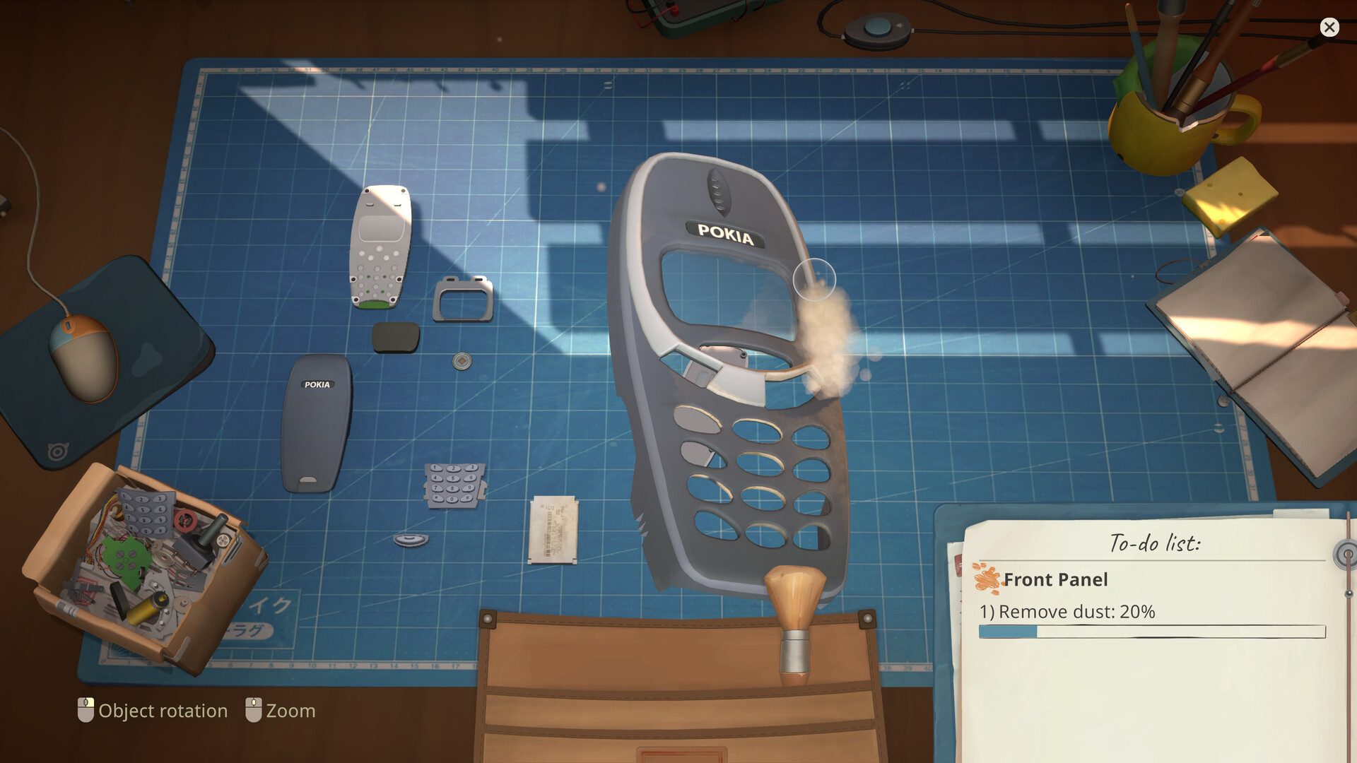 Pokia phone casing and keypad pieces with a brush and remove-dust task list.