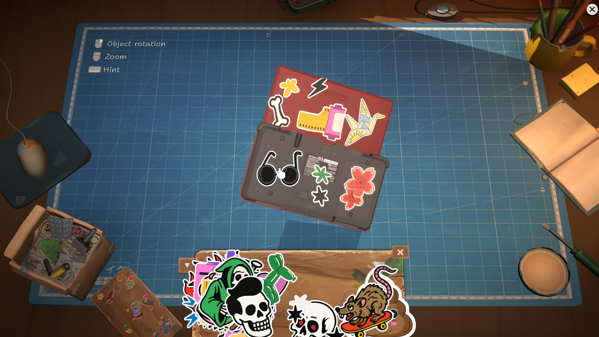 Patento BS handheld decorated with stickers in the device customization interface.