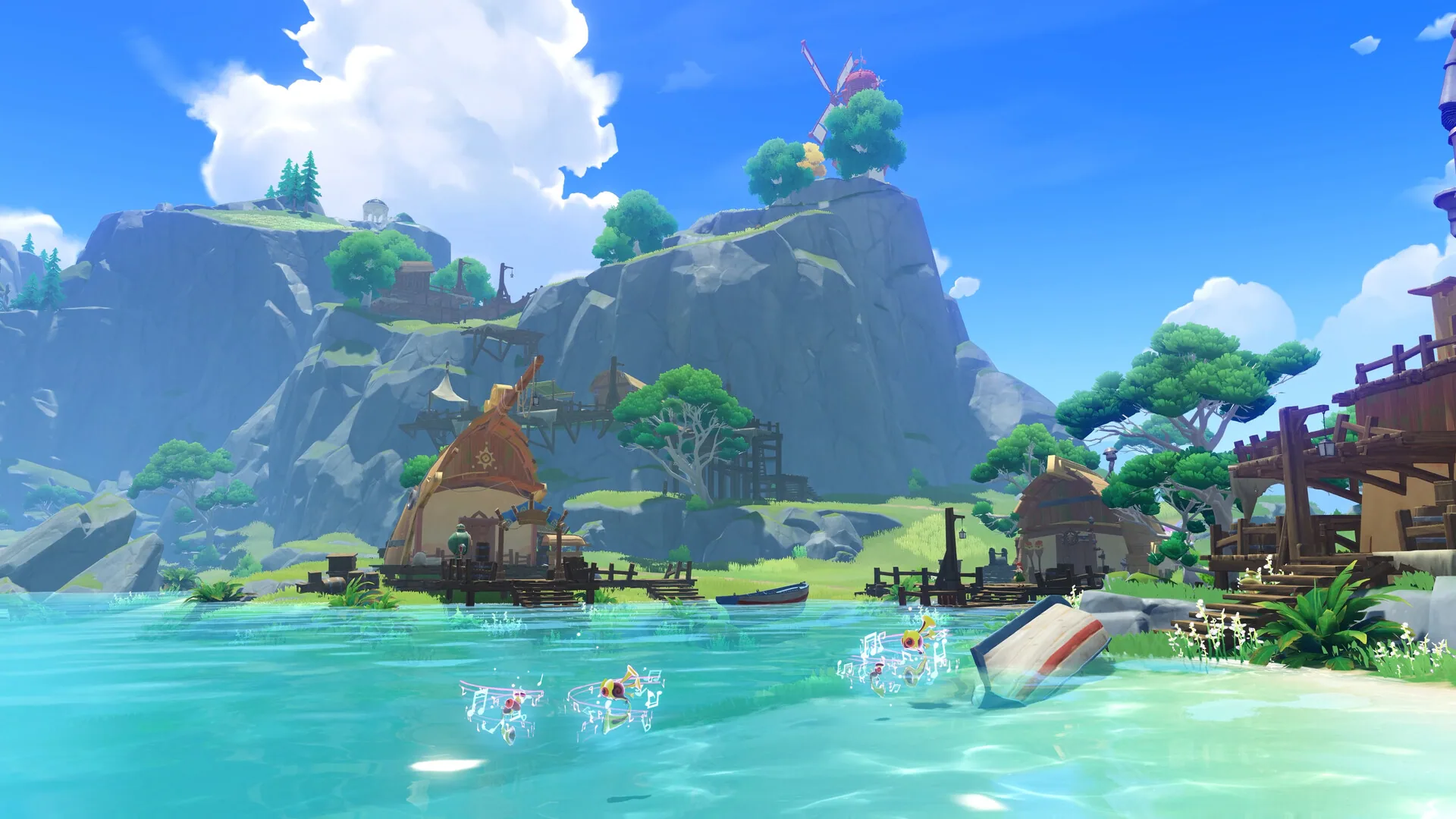 A lagoon village of wooden houses beneath grassy cliffs