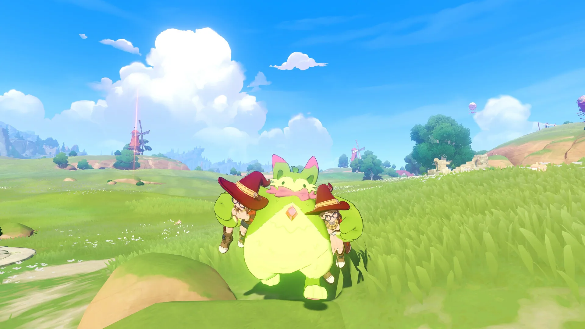 Two Rocos in witch hats riding a large green cat Jini across a meadow