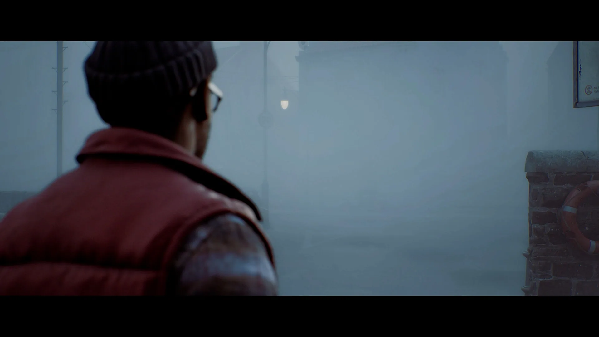 A close first-person melee encounter in a dark interior.