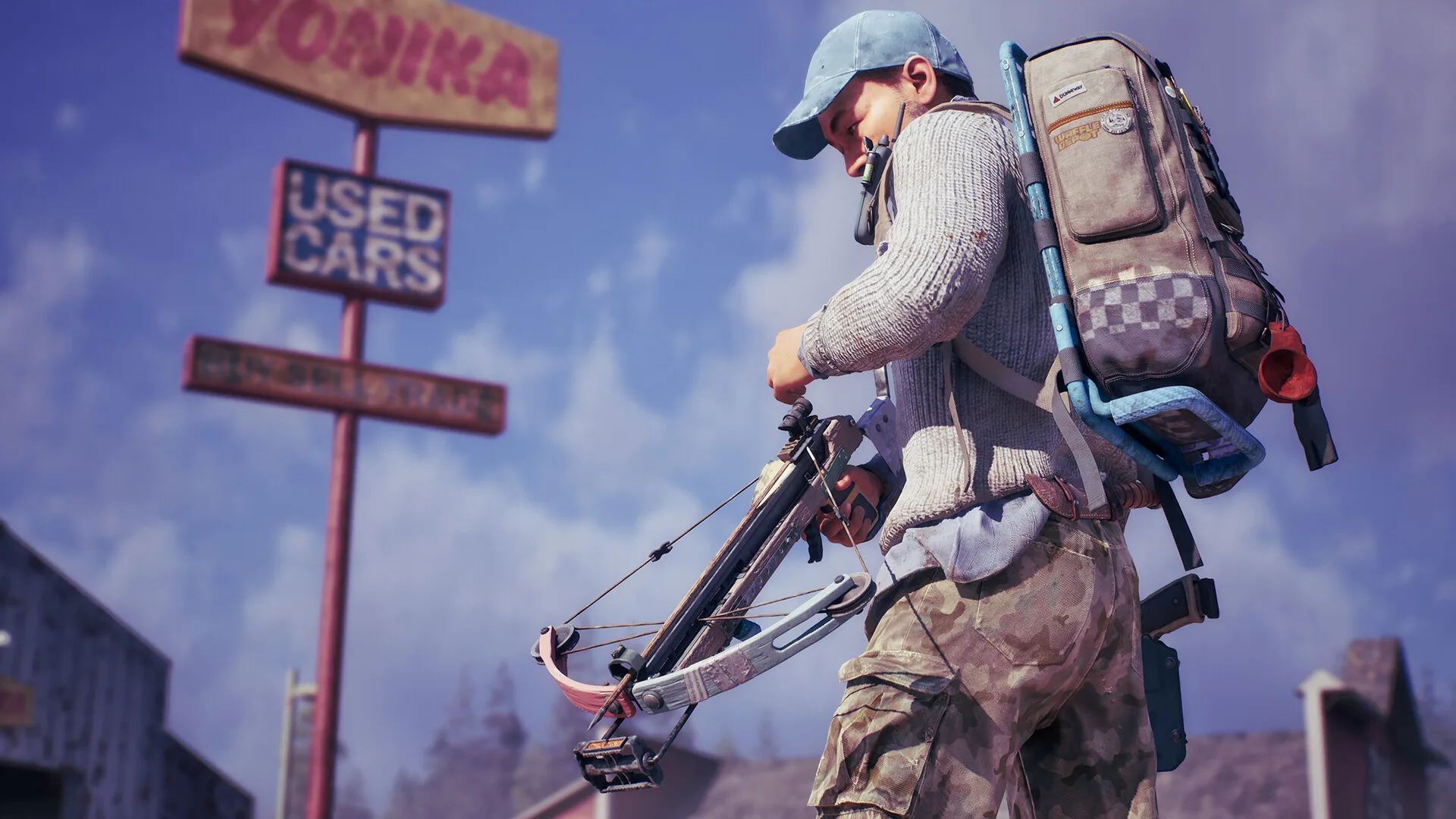 Survivor in a cap and checkered backpack readying a compound crossbow beneath a used-car sign
