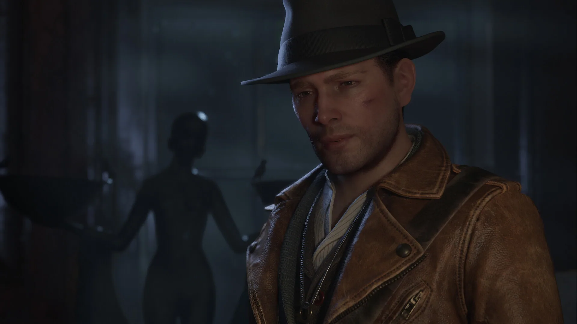 Close-up of Calvin Rafferty in a brown leather jacket and fedora, bruised, with a silhouetted figure behind him