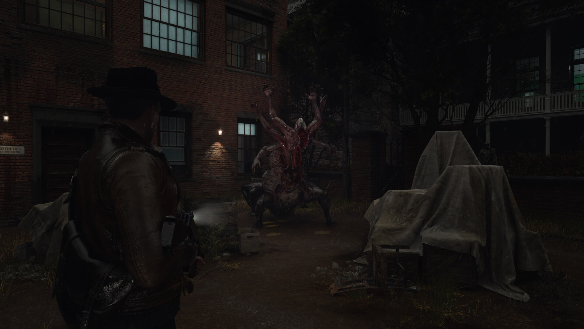 Calvin Rafferty aims a flashlight and gun at a multi-armed fleshy creature in a brick courtyard at night