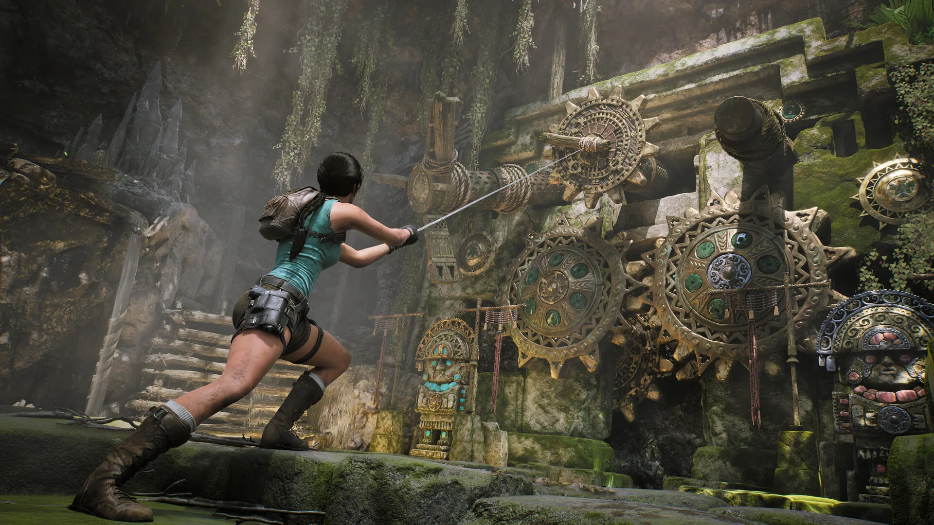 Lara uses a grappling hook beside a jungle cog mechanism.