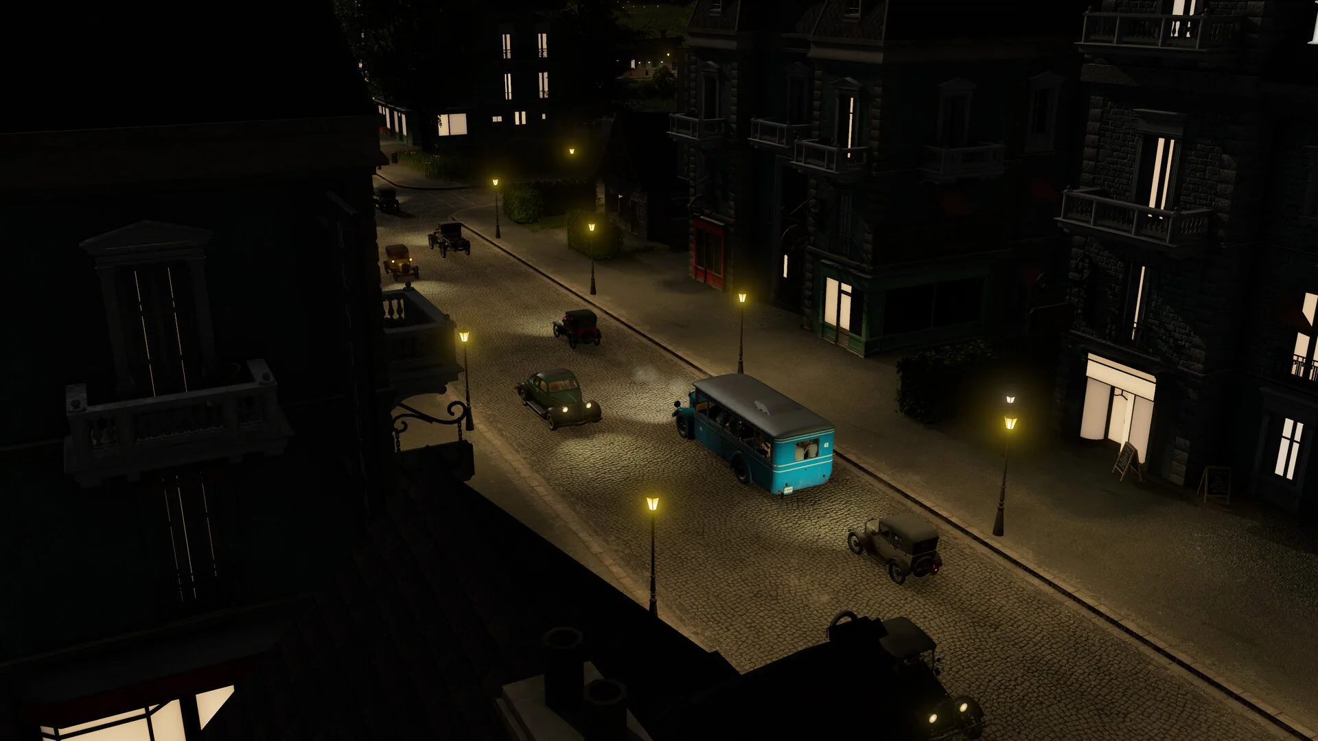 Night cobblestone street with a blue vintage bus and gas lamps