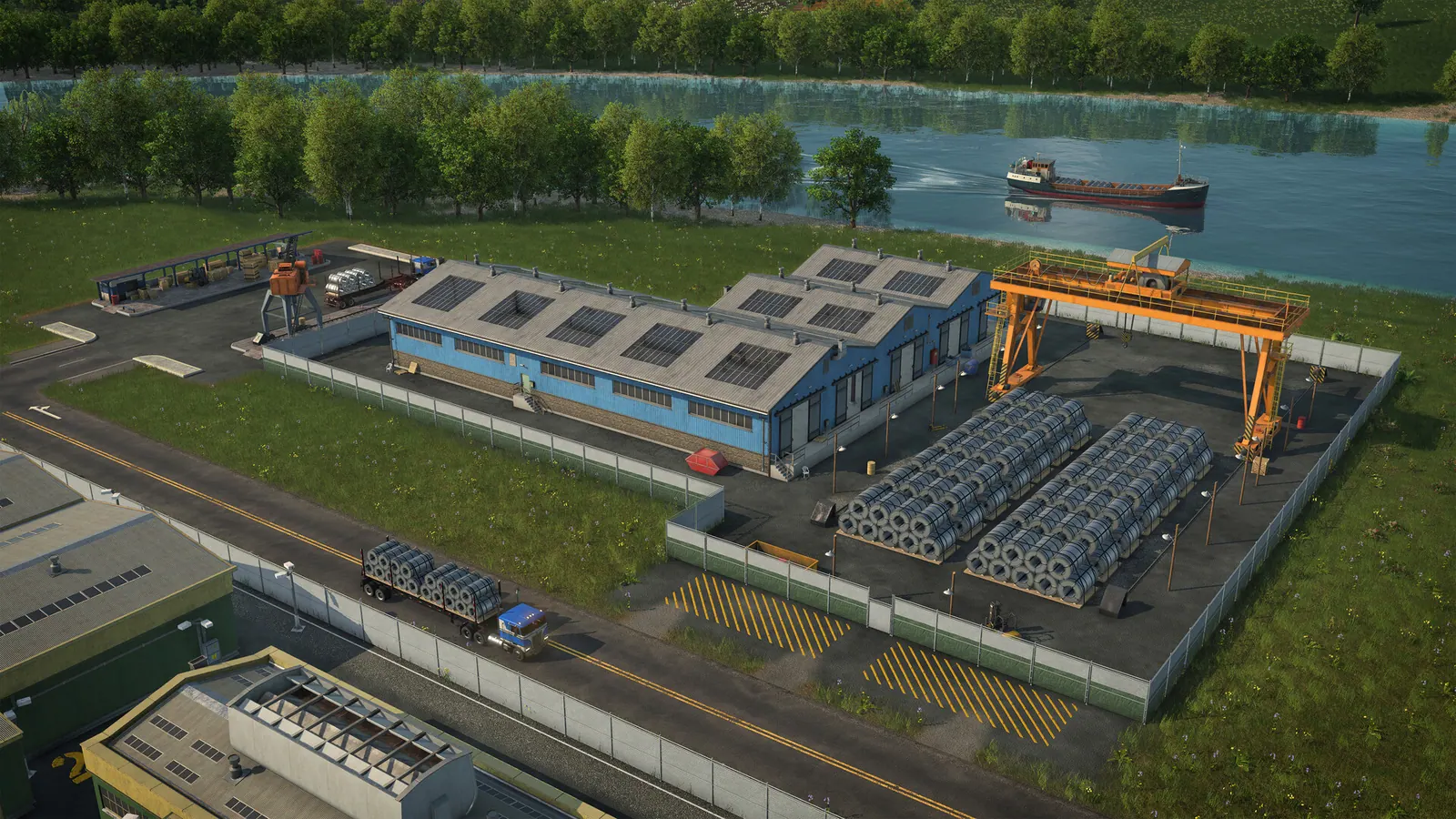Blue riverside warehouse with steel-coil stacks and a gantry crane